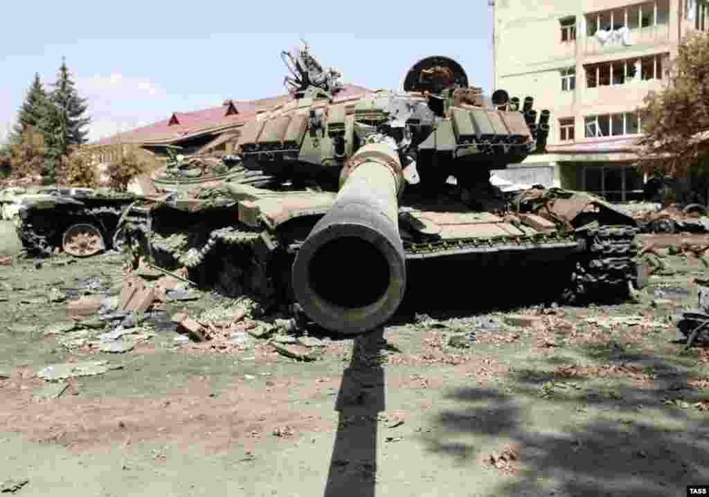 A destroyed Georgian tank sits among the ruins of Tskhinvali on August 14. Russian and Georgian officials reached a cease-fire plan on August 12, which would be signed by the South Ossetian and Abkhaz leaders two days later.