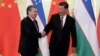 Uzbek President Shavkat Mirziyoev (left) meets Chinese President Xi Jinping in Beijing on April 25.