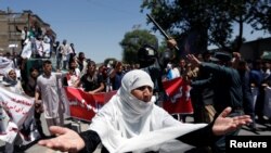 Afghanistan - An Afghan woman chants slogans during a protest in Kabul, Afghanistan June 2, 2017