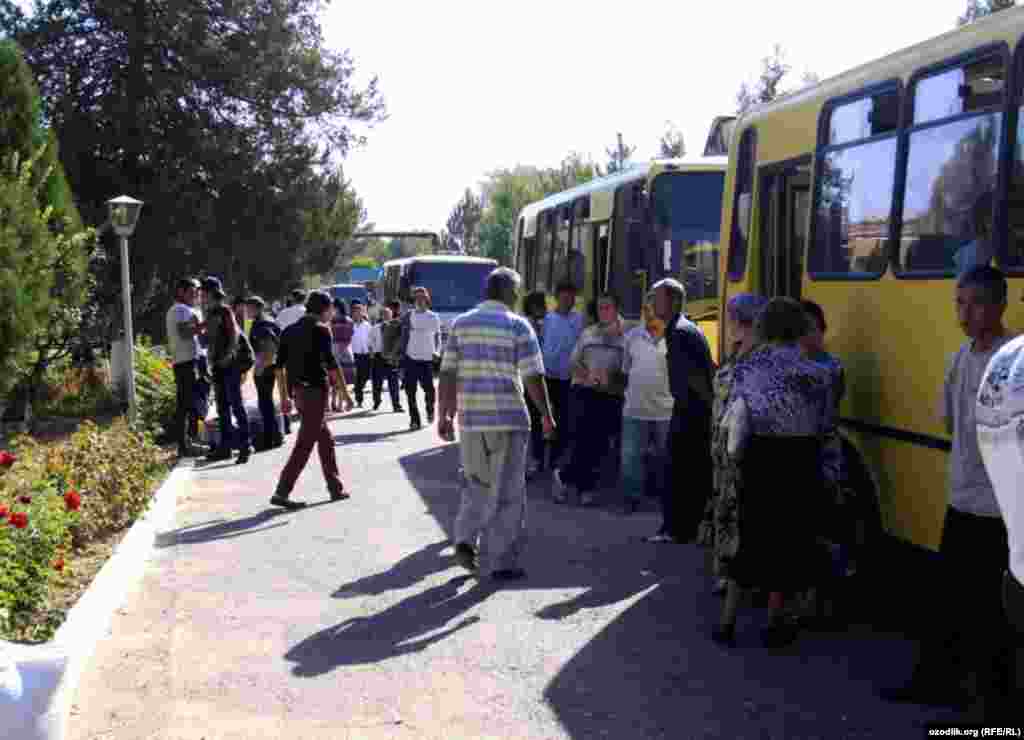 Students gather clothes and food at their university before boarding buses to the cotton fields, as arranged by their school's administration.