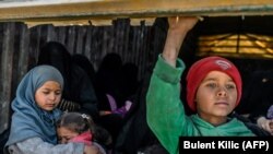Suriyada münaqişə bölgəsindən çıxarılan uşaqlar