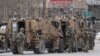 AFGHANISTAN -- NATO soldiers inspect near the site of an attack in Kabul, March 25, 2020