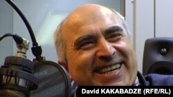 RFE/RL Georgian Service director David Kakabadze laughs during filming of the 'Inside Joke' feature.