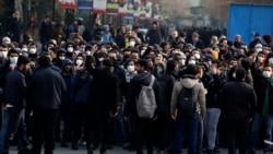 Anti-government protesters attend a demonstration blaming the government for the downing of a Ukrainian plane in Tehran on January 14.