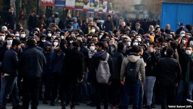 Anti-government protesters attend a demonstration blaming the government for the downing of a Ukrainian plane in Tehran on January 14.
