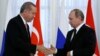 Russia -- Russian President Vladimir Putin shakes hands with Turkish President Tayyip Erdogan during a news conference following their meeting in St. Petersburg, August 9, 2016. 