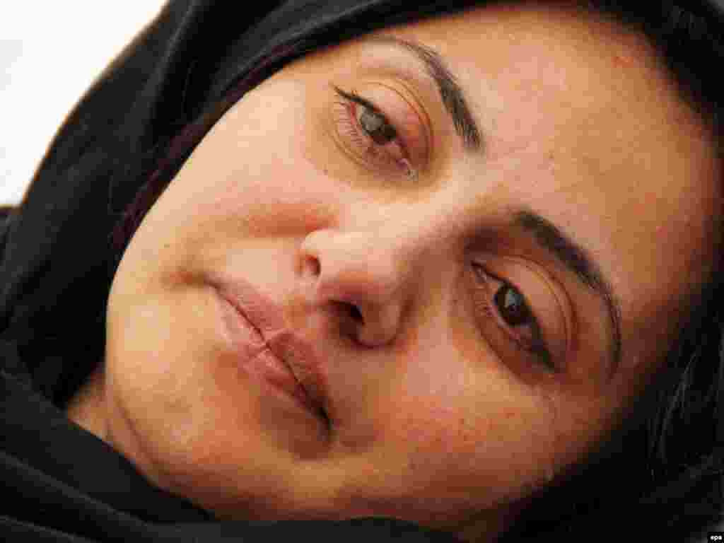 Afghanistan -- Simeen Barakzai, a parliamentarian who was unseated by the Independent Election Commission (IEC) in August, weeps in her tent-camp during her hunger strike, outside the Parliament, in Kabul, 09Oct2011