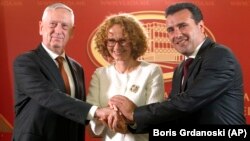 U.S. Defense Secretary Jim Mattis (left), Macedonian Prime Minister Zoran Zaev (right), and Macedonian Defense Minister Radmila Sekerinska shake hands after their meeting at the government building in Skopje on September 17.