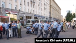 Russian police dispersing a rally in Moscow on August 12.