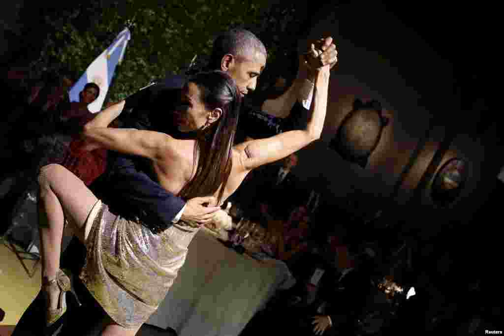 U.S. President Barack Obama dances the tango during a state dinner hosted by Argentina's President Mauricio Macri as part of Obama's two-day visit to Buenos Aires. (Reuters/Carlos Barria)