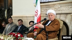 Former Iranian President Akbar Hashemi Rafsanjani (right)