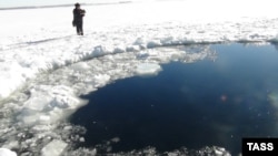 Russia's Emergency Situations Ministry released this photo of a hole in the ice atop a lake in the Chelyabinsk region thought to have been caused by a meteorite from the February 15 incident.