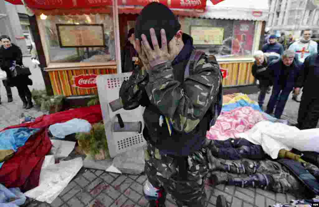 An activist mourns fellow protesters killed in clashes.