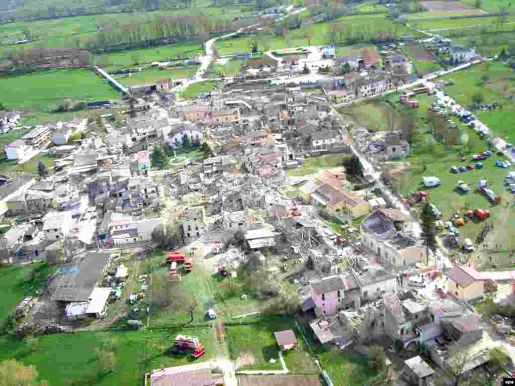 Italy -- The village of Onna seriously hit by the earthquake, in the province of L'Aquila, 06Apr2009 - Caption: epa01690056 A view from helicopter shows the village of Onna, in the province of L'Aquila, Italy seriously hit by the earthquake on 06 April 2009. Some 90 people died the quake, which struck the ancient town of L'Aquila and the surrounding mountainous areas about 100 km north-east of Rome in the early hours.