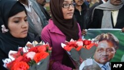 Supporters of the country's former military ruler, Pervez Musharraf, gather on January 2 outside the Armed Forces Institute of Cardiology in Rawalpindi, where he was reportedly undergoing treatment.