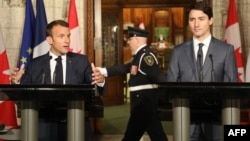 Canadian Prime Minister Justin Trudeau (right) and French President Emmanuel Macron hold press conference.