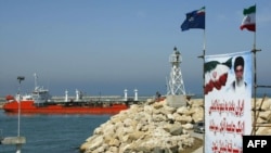 An Iranian oil tanker is seen floating on the Caspian Sea, as Iranian President Mohammad Khatami attends the opening ceremony 29 April 2004, of the Neka oil terminal on the Caspian Sea, 340 kms northwest of Tehran in Mazandaran province, a swap agreement 