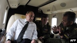 (Слева направо) Президент России Владимир Путин, начальник Генштаба России Валерий Герасимов и министр обороны России Сергей Шойгу. Архивное фото