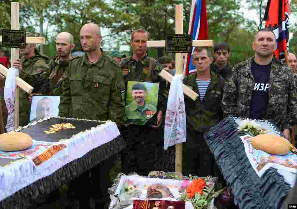 A funeral ceremony is held for Aleksei Mozgovoi, a leading pro-Russian separatist commander in eastern Ukraine, and two of his fellow fighters in Alchevsk in Ukraine's eastern Luhansk region. He and six other rebels were killed by an unknown group on May 23.(TASS/Mikhail Sokolov)