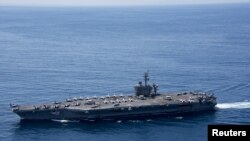 The aircraft carrier USS Carl Vinson is beginning joint exercises with two Japanese destroyers in the Pacific Ocean. (file photo)