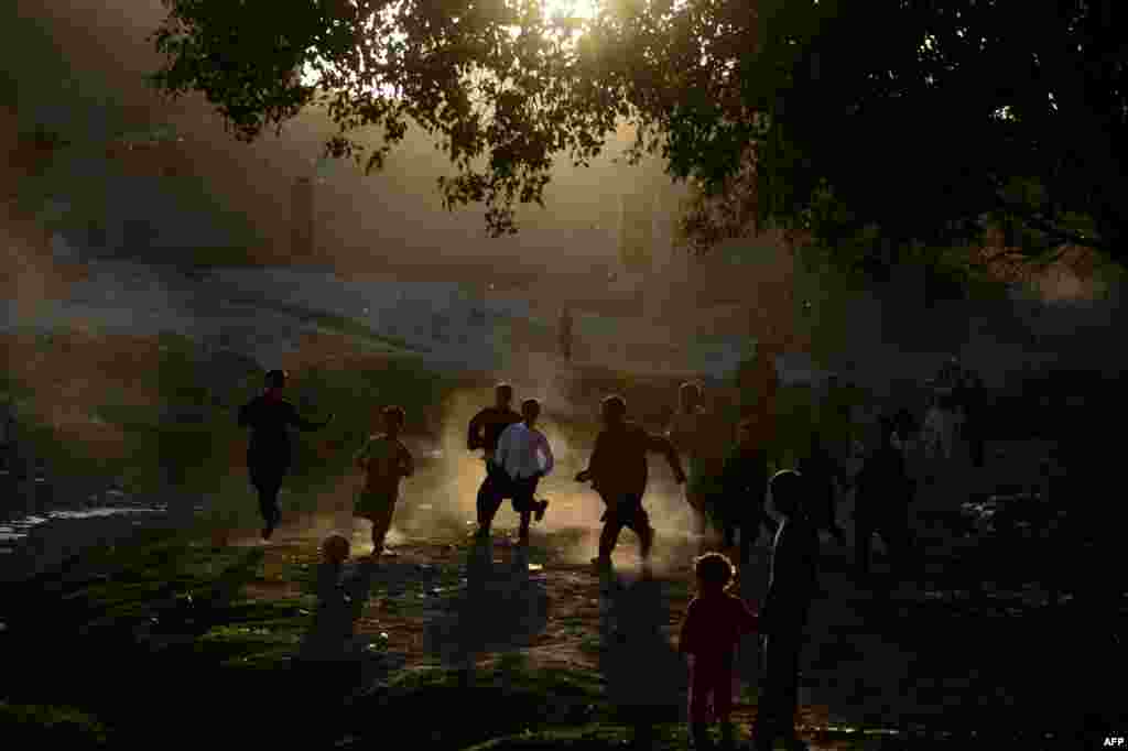 Afghan boys play soccer in a field in Herat. (AFP/Aref Karimi)