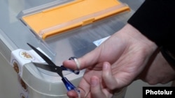 Armenia - An official opens a ballot box after the end of voting in a constitutional referendum, Yerevan, 6Dec2015.