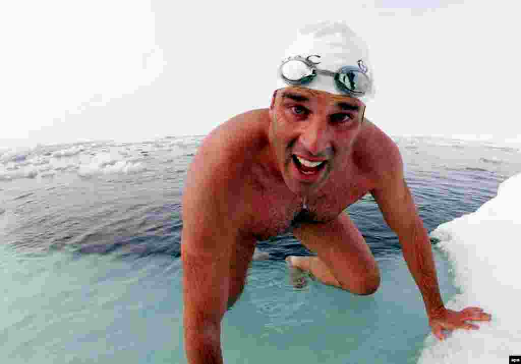 U.K. -- British explorer and endurance swimmer Lewis Gordon Pugh successfully completes the extraordinary challenge of being the first man to swim in the waters of the North Pole, 15Jul2007