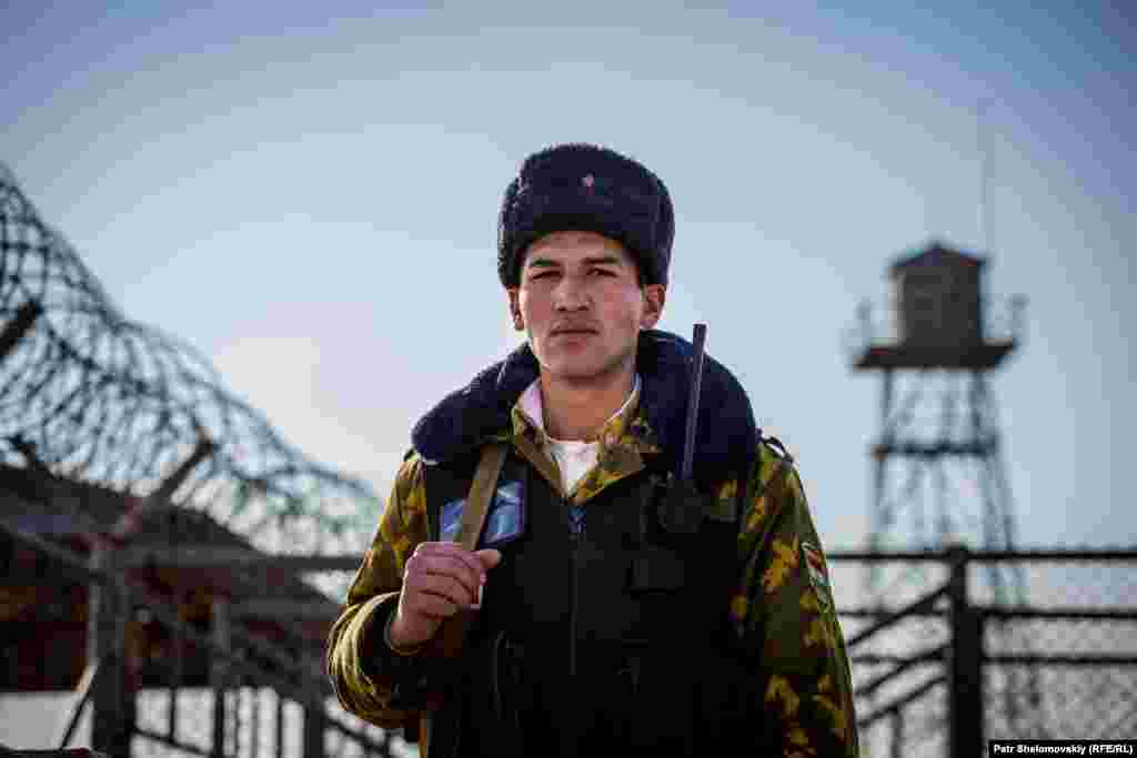 BORDER - Panj-e Payon border crossing, soldiers, guards, barracks Tajik border guard is on duty in Panj-e Payon border crossing with Afghanistan