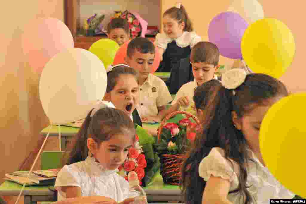 Children gather for their first day of school after the summer holidays at the Nairi Zaryan school in Yerevan.