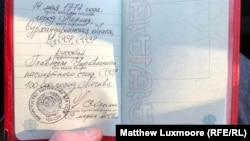 Konstantin Vyatkin shows off his "Soviet" passport.