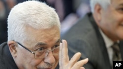 Palestinian leader Mahmud Abbas gestures before the start of a meeting with UN Secretary-General Ban Ki-moon at UN headquarters in New York on September 19.