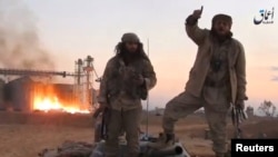 A screen grab from a video released by the Islamic State-affiliated Amaq news agency, said to be in Palmyra on December 11