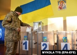 A Ukrainian serviceman casts his ballot during his country's presidential election on March 31.
