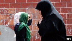 Iranian women walk on a street in Tehran. (file photo)