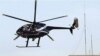 A private Blackwater helicopter flies over Baghdad