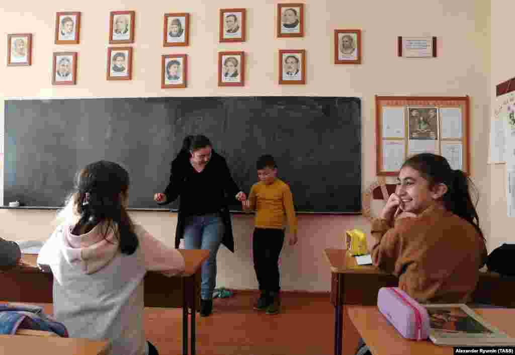 A boy being taught a traditional Armenian dance in a Stepanakert school on December 2. Ahead of the cease-fire agreement, Azerbaijan&#39;s military overwhelmed ethnic Armenian separatist forces and threatened to advance on Stepanakert.