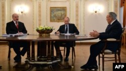 Russia -- (R-L) Kazakh president Nursultan Nazarbaev, Russian President Vladimir Putin and Belarus President Alyaksandr Lukashenka speak during their meeting in Putin's Novo-Ogaryovo residence outside Moscow, March 5, 2014