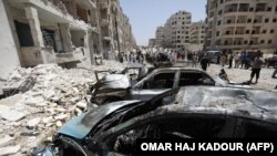 Архива: Луѓе собрани по експлозија на автомобил-бомба во сириската провинција Идлиб. 26.05.2018.