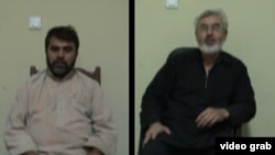 Afghan citizens Syed Kamal (in black) and Syed Hussain were arrested on charges of spying for Iran.