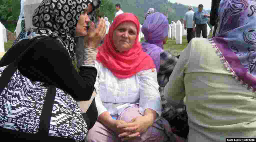 Hava Muhic (center), the mother of Fatima, the youngest victim of the mass killing