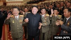 North Korean leader Kim Jong Un (center) attends an art performance dedicated to nuclear scientists and technicians who worked on a hydrogen bomb that the regime claimed to have successfully tested in Pyongyang on September 10.