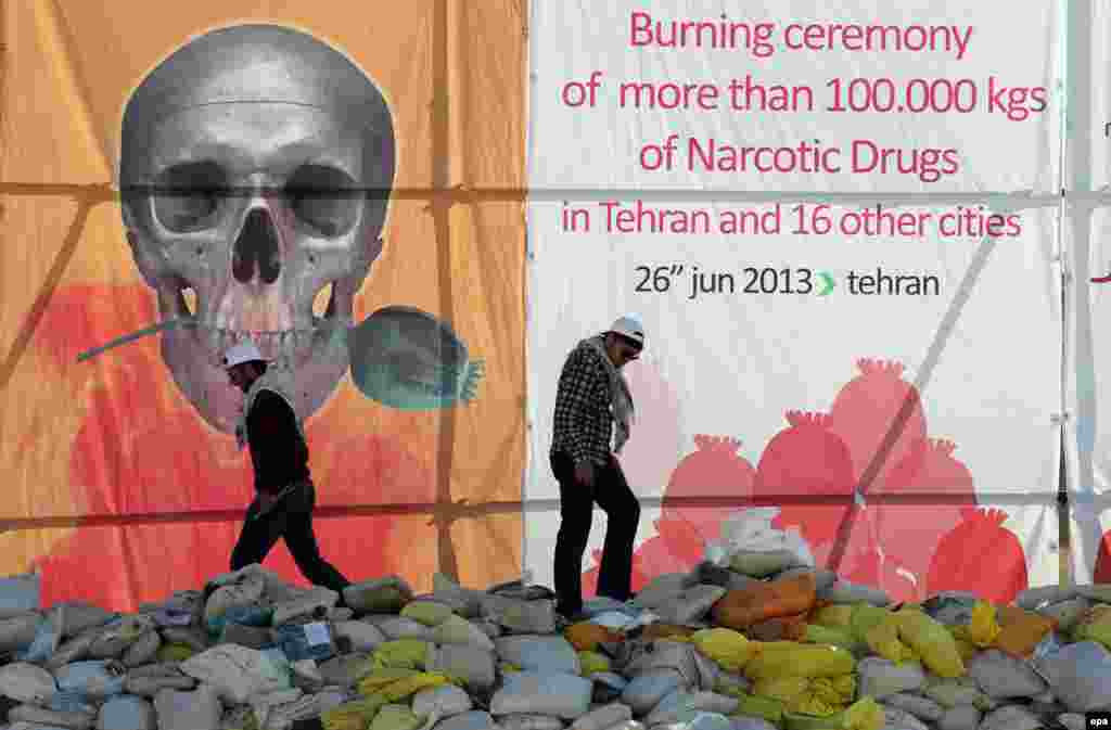 Iran -- Police preapare a pile of drugs before an incineration ceremony of some 50 tons of illicit drugs in an annual ritual in Tehran, 26Jun2013
