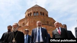 Nagorno-Karabakh -- Armenian Prime Minister Nikol Pashinian (C), Karabakh President Bako Sahakian (R) and Archbishop Pargev Martirosian leave a newly built church in Stepanakert, May 9, 2019.