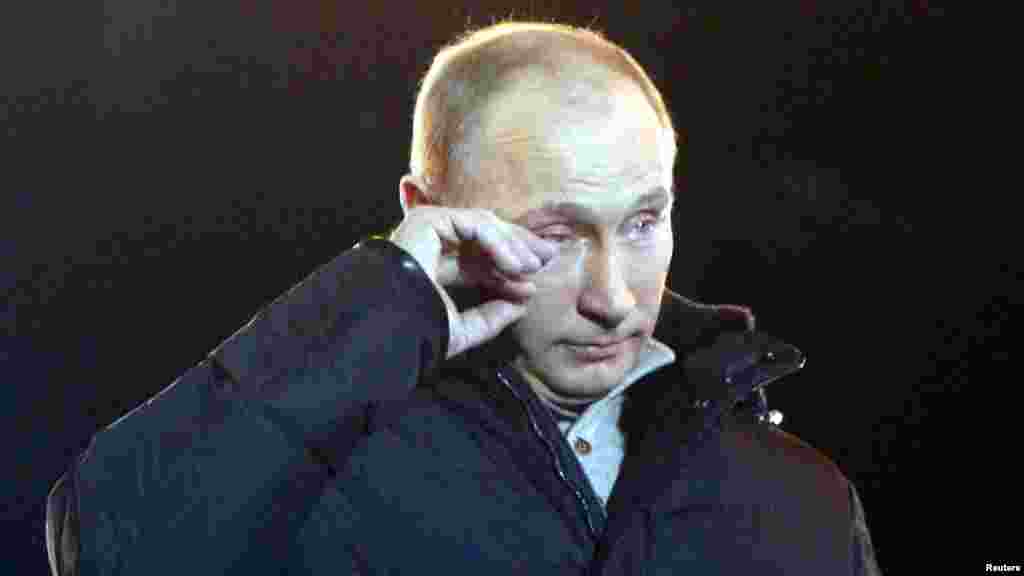 Prime Minister Vladimir Putin appears to wipe away a tear as he addresses supporters during a rally in Manezh Square near the Kremlin on March 2012.