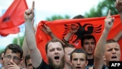 People protest in the Macedonian capital on May 11 against the arrest of six people over their alleged involvement in last month's murder of five people near Skopje.