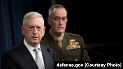 Defense Secretary James N. Mattis and Marine Corps Gen. Joe Dunford, chairman of the Joint Chiefs of Staff, brief reporters on the current U.S. airstrikes on Syria during a joint news conference at the Pentagon, April 13, 2018.
