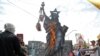 FILE - Pro-government demonstrators burn anti US and Israeli effigies during a rally marking Al-Qods Day (Jerusalem Day), in support of Palestinian resistance against Israeli occupation, in Tehran, July 1, 2016. 