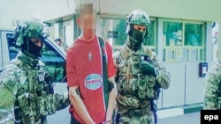 Gregoire Moutaux, was stopped on the Polish-Ukrainian border on May 21 with 125 kilograms of explosives, five AK-series assault rifles, two antitank grenade launchers, some 5,000 rounds of ammunition, and 100 detonators. Ukrainian officials claim he planned more than a dozen attacks.