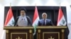 Iraqi Shi'ite cleric Moqtada al-Sadr (left) and Iraqi prime Minister Haider al-Abadi. (file photo)