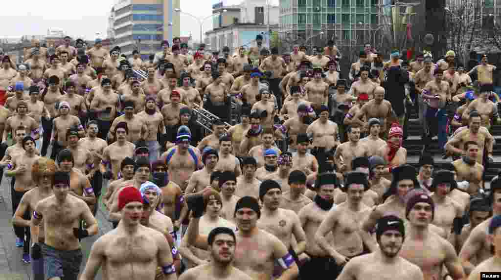 Half-naked participants run in the Real Men's Race to mark Defender of the Fatherland Day in Minsk on February 23. (Reuters/Vasily Fedosenko)